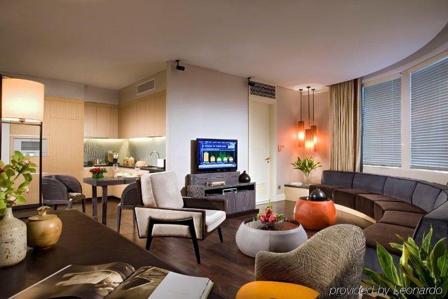 Ascott Raffles Place Szingapúr Szoba fotó A modern living room